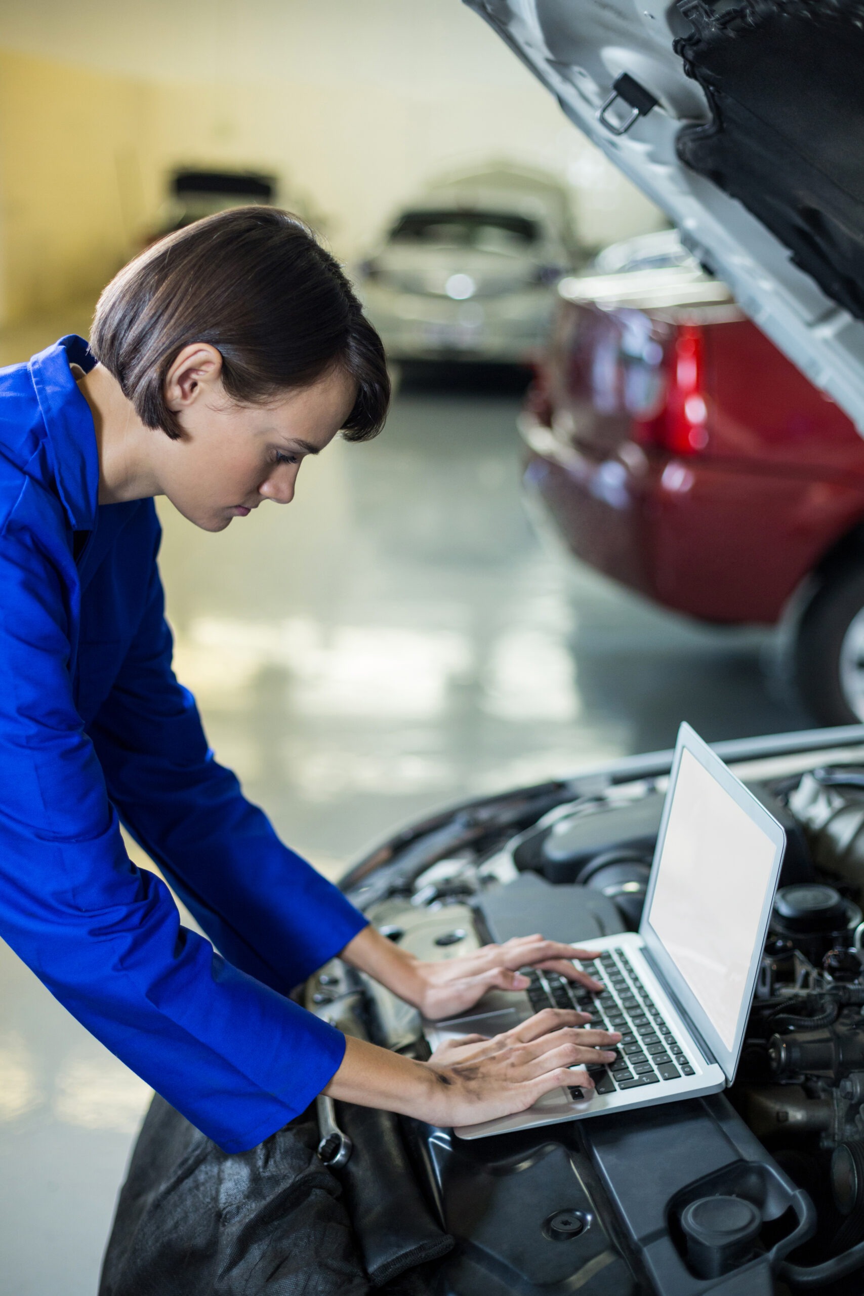 Technician using laptop to calibrate settings